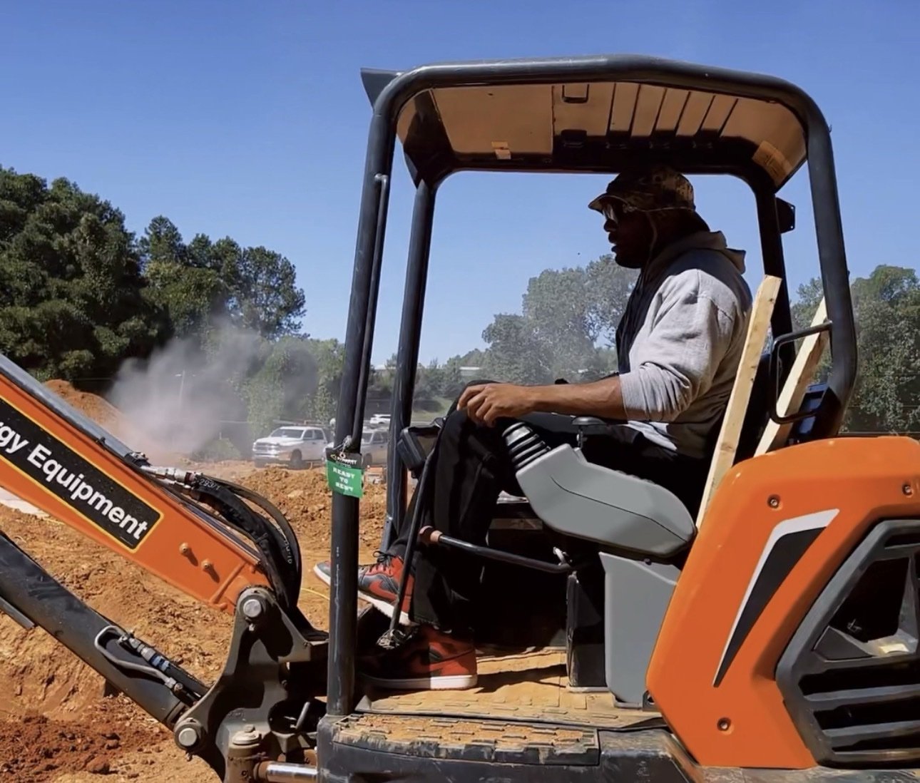 Rashad operating an excavator on site