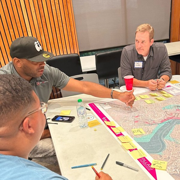 Rashad working a site plan with partners